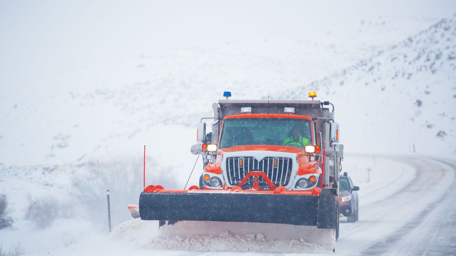 Municipal public works truck in branded livery on a city street