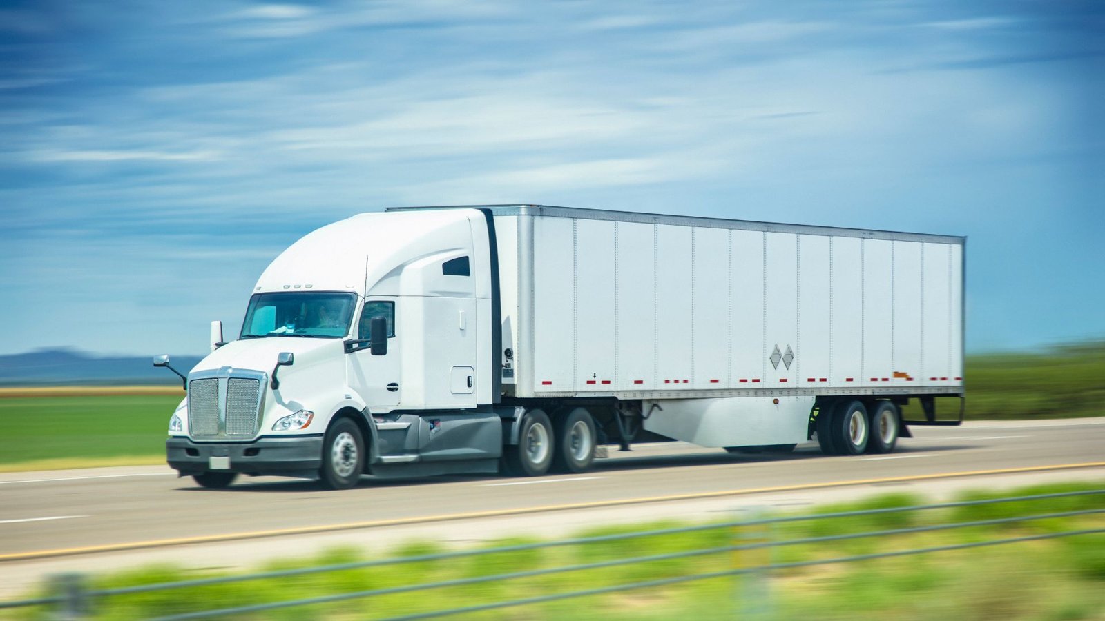 Multiple fleet trucks staged in various stages of a managed refinish program